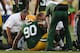 GREEN BAY, WI - AUGUST 30: B.J. Raji #90 of the Green Bay Packers is looked after by doctors early against the Kansas City Chiefs during a preseason game at Lambeau Field on August 30, 2012 in Green Bay, Wisconsin. (Photo by Jonathan Daniel/Getty Images)