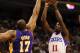 Feb 06, 2012; Philadelphia, PA, USA; Philadelphia 76ers guard Jrue Holiday (11) shoots over the defense of Los Angeles Lakers Andrew Bynum (17) during the first quarter at the Wells Fargo Center. Mandatory Credit: Howard Smith-US PRESSWIRE