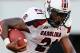 ATHENS, GA - SEPTEMBER 10: Marcus Lattimore #21 of the South Carolina Gamecocks rushes upfield against Cornelius Washington #83 of the Georgia Bulldogs at Sanford Stadium on September 10, 2011 in Athens, Georgia. (Photo by Kevin C. Cox/Getty Images)