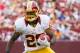 Aug 25, 2012; Landover, MD, USA; Washington Redskins running back Tim Hightower runs the ball against the Indianapolis Colts during the second half at FedEx Field. Mandatory Credit: Paul Frederiksen-US PRESSWIRE