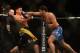 Jul. 7, 2012; Las Vegas, NV, USA; UFC fighter Patrick Coto (right) punches Cung Le during a middleweight bout in UFC 148 at the MGM Grand Garden Arena. Mandatory Credit: Mark J. Rebilas-US PRESSWIRE