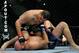 LOS ANGELES, CA - OCTOBER 24: UFC fighter Cain Velasquez (top) battles with UFC fighter Ben Rothwell (bottom) during their Heavyweight bout at UFC 104: Machida vs. Shogun at Staples Center on October 24, 2009 in Los Angeles, California. (Photo by Jon Kopaloff/Getty Images)