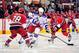 RALEIGH, NC - MARCH 01: Brian Boyle #22 of the New York Rangers moves the puck between Justin Faulk #28 and Eric Staal #12 of the Carolina Hurricanes during play at the RBC Center on March 1, 2012 in Raleigh, North Carolina. (Photo by Grant Halverson/Getty Images)