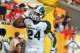 TMAPA, FL - JANUARY 02: Running back Le'Veon Bell #24 of the Michigan State Spartans celebrates after a touchdown run against the Georgia Bulldogs in the Outback Bowl January 2, 2012 at Raymond James Stadium, Tampa Florida. The Spartans won 33 - 30. (Photo by Al Messerschmidt/Getty Images)