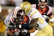 ATLANTA, GA - NOVEMBER 10: Jeremiah Attaochu #45 of the Georgia Tech Yellow Jackets tackles Josh Oglesby #2 of the Virginia Tech Hokies at Bobby Dodd Stadium on November 10, 2011 in Atlanta, Georgia. (Photo by Kevin C. Cox/Getty Images)