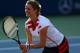 NEW YORK, NY - AUGUST 31: Kim Clijsters of Belgium reacts during a first round mixed doubles match with her partner Bob Bryan of the United States against Irina Falconi of the United States and Steve Johnson of the United States on Day Five of the 2012 US Open at USTA Billie Jean King National Tennis Center on August 31, 2012 in the Flushing neigborhood of the Queens borough of New York City. (Photo by Al Bello/Getty Images)
