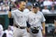 CLEVELAND, OH - AUGUST 24: Derek Jeter #2 reacts after being hit in the head by a pitch as manager Joe Girardi #28 of the New York Yankees walks him to first bast during the second inning against the Cleveland Indians at Progressive Field on August 24, 2012 in Cleveland, Ohio. (Photo by Jason Miller/Getty Images)