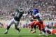 Aug 31, 2012; East Lansing, MI, USA; Michigan State Spartans running back Le'Veon Bell (24) gets away from Boise State Broncos cornerback Jerrell Gavins (4) to score a touchdown in the fourth quarter at Spartan Stadium. Mandatory Credit: Andrew Weber-US Presswire