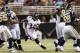 ST. LOUIS, MO - AUGUST 30: Running back Bobby Rainey #34 of the Baltimore Ravens runs through a hole in the offensive line during the game against the St. Louis Rams at the Edward Jones Dome on August 30, 2012 in St. Louis, Missouri. (Photo by David Welker/Getty Images)