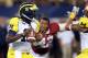 ARLINGTON, TX - SEPTEMBER 01: Denard Robinson #16 of the Michigan Wolverines throws the ball against the Alabama Crimson Tide at Cowboys Stadium on September 1, 2012 in Arlington, Texas. (Photo by Ronald Martinez/Getty Images)