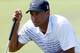 KIAWAH ISLAND, SC - AUGUST 11: Tiger Woods of the United States lines up a putt on the first green during Round Three of the 94th PGA Championship at the Ocean Course on August 11, 2012 in Kiawah Island, South Carolina. (Photo by Sam Greenwood/Getty Images)