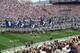 The Penn State team runs onto the field while 600 student-athletes from 31 varsity sports stand on the field to thank them and cheer them on. Photo by Carolyn M. Todd. All Rights Reserved.