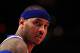 NEW YORK, NY - APRIL 13: Carmelo Anthony #7 of the New York Knicks looks on against the Washington Wizards at Madison Square Garden on April 13, 2012 in New York City. NOTE TO USER: User expressly acknowledges and agrees that, by downloading and/or using this Photograph, user is consenting to the terms and conditions of the Getty Images License Agreement. (Photo by Chris Trotman/Getty Images)