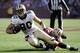 SAN FRANCISCO, CA - JANUARY 14: Jimmy Graham #80 of the New Orleans Saints gets tackled by Patrick Willis #52 of the San Francisco 49ers in the second quarter during the Divisional Playoffs at Candlestick Park on January 14, 2012 in San Francisco, California. The 49ers won the game 36-32. (Photo by Thearon W. Henderson/Getty Images)