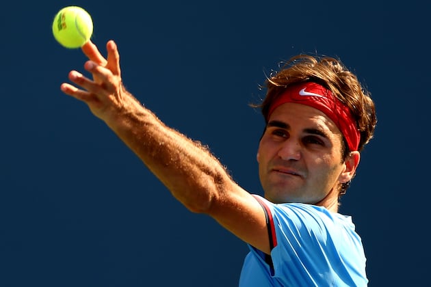 Federer into US Open last eight as Fish pulls out
