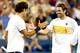 MASON, OH - AUGUST 17: Roger Federer of Switzerland is congratulated by Mardy Fish after their match during the Western & Southern Open at the Lindner Family Tennis Center on August 17, 2012 in Mason, Ohio. (Photo by Matthew Stockman/Getty Images)