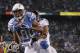 SAN DIEGO, CA - DECEMBER 18: Wide receiver Malcom Floyd #80 of the San Diego Chargers catches a pass for a touchdown ahead of Jimmy Smith #22 of the Baltimore Ravens in the third quarter at Qualcomm Stadium on December 18, 2011 in San Diego, California. (Photo by Jeff Gross/Getty Images)