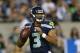 Russell Wilson impressed during his senior season at Wisconsin and in Seattle's perfect preseason. Can he continue winning as the regular season starter?
