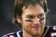 FOXBORO, MA - JANUARY 16: Quarterback Tom Brady #12 of the New England Patriots smiles while talking to the media after the AFC divisional playoff game against the Indianapolis Colts at Gillette Stadium on January 16, 2005 in Foxboro, Massachusetts. The Patriots defeated the Colts 20-3. (Photo By Harry How/Getty Images)