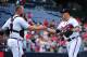 ATLANTA, GA - SEPTEMBER 03: David Ross #8 (L) and Kris Medlen #54 of the Atlanta Braves celebrate after the game against the Colorado Rockies at Turner Field on September 3, 2012 in Atlanta, Georgia. (Photo by Scott Cunningham/Getty Images)