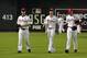 July 12, 2011; Phoenix, AZ, USA; National League pitchers Cliff Lee (left) , Cole Hamels (middle) and Roy Halladay of the Philadelphia Phillies walk off the field before the 2011 All Star game at Chase Field. Mandatory Credit: Scott Rovak-US PRESSWIRE