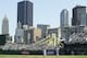 PITTSBURGH, PA- APRIL 10: A general view of the Pittsburgh skyline with Olmedo Saenz #8 of the Los Angeles Dodgers and Sean Casey #25 of the Pittsburgh Pirates on the field on April 10, 2006 at PNC Park in Pittsburgh, Pennsylvania. (Photo by Rick Stewart/Getty Images)