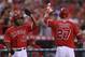 ANAHEIM, CA - AUGUST 30: Mike Trout (R) #27 of the Los Angeles Angels of Anaheim is congratulated by Howard Kendrick (L) #47 after scoring a run against the Boston Red Sox in the first inning at Angel Stadium of Anaheim on August 30, 2012 in Anaheim, California. (Photo by Jeff Gross/Getty Images)