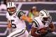 Aug. 18, 2011; East Rutherford, NJ, USA; New York Jets quarterback Tim Tebow (15) hands the ball off to running back Bilal Powell (29) against the New York Giants during the second half at MetLife Stadium. Giants won 26-3. Mandatory Credit: Debby Wong-US PRESSWIRE
