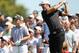 DORAL, FL - MARCH 13: Dustin Johnson watches his tee shot on the second hole as Luke Donald of England looks onduring the final round of the 2011 WGC- Cadillac Championship at the TPC Blue Monster at the Doral Golf Resort and Spa on March 13, 2011 in Doral, Florida. (Photo by Mike Ehrmann/Getty Images)