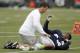 Aug 7, 2012; Renton, WA, USA; NFL: Seattle Seahawks running back Marshawn Lynch (24) is stretched by a team staff member during training camp drills at the Virginia Mason Athletic Center. Mandatory Credit: Joe Nicholson-US PRESSWIRE