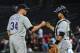 ATLANTA, GA - SEPTEMBER 4: Matt Belisle #34 and Wilin Rosario #20 of the Colorado Rockies celebrate after the game against the Atlanta Braves at Turner Field on September 4 2012 in Atlanta, Georgia. (Photo by Scott Cunningham/Getty Images)