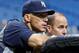 Manager Joe Girardi and GM Brian Cashman looking on