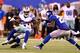 EAST RUTHERFORD, NJ - SEPTEMBER 05: Wide receiver Kevin Ogletree #85 of the Dallas Cowboys runs with the ball after a catch against free safety Antrel Rolle #26 of the New York Giants during the 2012 NFL season opener at MetLife Stadium on September 5, 2012 in East Rutherford, New Jersey. (Photo by Al Bello/Getty Images)