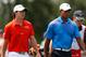FARMINGDALE, NY - AUGUST 24: Tiger Woods and Rory McIlroy (L) of Northern Ireland walk up the fairway on the second hole during the second round of The Barclays at the Black Course at Bethpage State Park August 24, 2012 in Farmingdale, New York. (Photo by Kevin C. Cox/Getty Images)