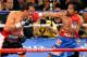 LAS VEGAS, NV - NOVEMBER 12: Manny Pacquiao (R) throws a right at Juan Manuel Marquez during the seventh round of their WBO world welterweight title fight at the MGM Grand Garden Arena November 12, 2011 in Las Vegas, Nevada. Pacquiao retained his title with a majority decision victory. (Photo by Ethan Miller/Getty Images)