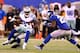 EAST RUTHERFORD, NJ - SEPTEMBER 05: Wide receiver Kevin Ogletree #85 of the Dallas Cowboys runs with the ball after a catch against free safety Antrel Rolle #26 of the New York Giants during the 2012 NFL season opener at MetLife Stadium on September 5, 2012 in East Rutherford, New Jersey. (Photo by Al Bello/Getty Images)