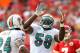 KANSAS CITY, MO - NOVEMBER 06: Karlos Dansby #58 of the Miami Dolphins celebrates after making a tackle during the game against the Kansas City Chiefs on November 6, 2011 at Arrowhead Stadium in Kansas City, Missouri. (Photo by Jamie Squire/Getty Images)