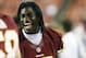 August 29, 2012; Landover, MD, USA; Washington Redskins quarterback Robert Griffin III (10) smiles on the sidelines against the Tampa Bay Buccaneers in the fourth quarter at FedEx Field. The Redskins won 30-3. Mandatory Credit: Geoff Burke-US PRESSWIRE