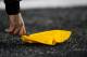 SEATTLE, WA - DECEMBER 12: An official picks up a penalty flag during a game between the St. Louis Rams and the Seattle Seahawks at CenturyLink Field December 12, 2011 in Seattle, Washington. Seattle won 33-13. (Photo by Jay Drowns/Getty Images)