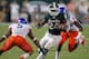 EAST LANSING, MI - AUGUST 31: Le'Veon Bell #24 of the Michigan State Spartans looks for running room between Jamar Taylor #5 and Samuel Ukwuachu #82 of the Boise State Broncos at Spartan Stadium on August, 2010 in East Lansing, Michigan. Michigan State won the game 17-13. (Photo by Gregory Shamus/Getty Images)
