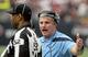 HOUSTON, TX - January 01: Head coach Mike Munchak of the Tennessee Titans yells at head lines man Julian Mapp about a Houston Texans late hit on special teams against the Tennessee Titans on January 1, 2012 at Reliant Stadium in Houston, Texas. Titans won 23 to 22. (Photo by Thomas B. Shea/Getty Images)