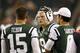 PHILADELPHIA - AUGUST 30: Matt Simms #9 talks with Tim Tebow #15 and Mark Sanchez #6 of the New York Jets during their preseason game against the Philadelphia Eagles at Lincoln Financial Field on August 30, 2012 in Philadelphia, Pennsylvania. (Photo by Jeff Zelevansky/Getty Images)