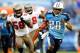 NASHVILLE, TN - NOVEMBER 27: Chris Johnson #28 of the Tennessee Titans breaks away from Quincy Black #58 and John McCargo #79 of the Tampa Bay Buccaneers for a long gain during play at LP Field on November 27, 2011 in Nashville, Tennessee. The Titans won 23-17. (Photo by Grant Halverson/Getty Images)