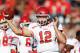 TUCSON, AZ - NOVEMBER 05: Quarterback Adam Schulz #12 of the Utah Utes warms up before the college football game against the Arizona Wildcats at Arizona Stadium on November 5, 2011 in Tucson, Arizona. The Utes defeated the Wildcats 34-21. (Photo by Christian Petersen/Getty Images)