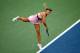 NEW YORK, NY - SEPTEMBER 05: Maria Sharapova of Russia serves to Marion Bartoli of France during their women's singles quarterfinal match on Day Ten of the 2012 US Open at USTA Billie Jean King National Tennis Center on September 5, 2012 in the Flushing neighborhood of the Queens borough of New York City. (Photo by Elsa/Getty Images)