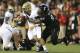 Tino Sunseri unable to elude the Bearcat's pressure.