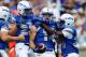 September 1, 2012; Colorado Springs, CO, USA; Air Force Falcons wide receiver Colton Huntsman (14) is greeted by teammates after scoring a touchdown during the fourth quarter against the Idaho State Bengals at Falcon Stadium. Mandatory Credit: Chris Humphreys-US PRESSWIRE