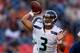 DENVER, CO - AUGUST 18: Quarterback Russell Wilson #3 of the Seattle Seahawks warms up on the field before a pre-season game against the Denver Broncos at Sports Authority Field Field at Mile High on August 18, 2012 in Denver, Colorado. (Photo by Justin Edmonds/Getty Images)