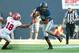 September 7, 2012; Logan, UT, USA; Utah State Aggies quarterback Chuckie Keeton (16) avoids the tack of Utah Utes defensive back Eric Rowe (18) during the first half at Romney Stadium. Mandatory Credit: Russ Isabella-US PRESSWIRE