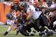 CINCINNATI, OH - JANUARY 01: Bernard Scott #28 of the Cincinnati Bengals runs with the ball while tackled by Jarret Johnson #95 and Haloti Ngata #92 of the Baltimore Ravens during the NFL game at Paul Brown Stadium on January 1, 2012 in Cincinnati, Ohio. (Photo by Andy Lyons/Getty Images)